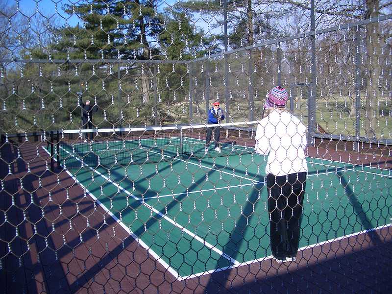 CIMG2394.JPG - Iona at the net while her partner serves